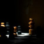 a group of chess pieces sitting on top of a chess board